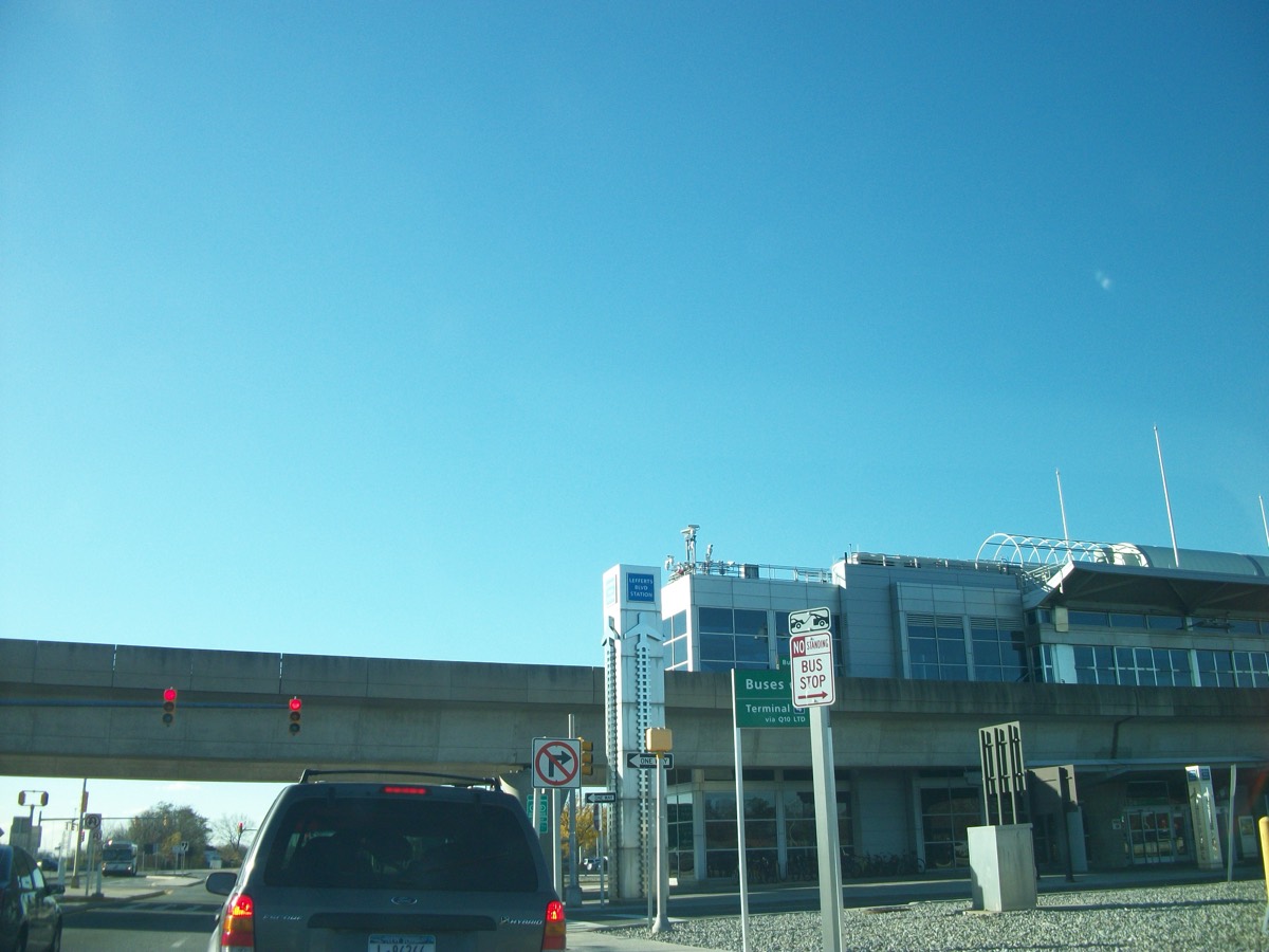 An AirTrain car pulling into an elevated station between terminals at New York's JFK airport.